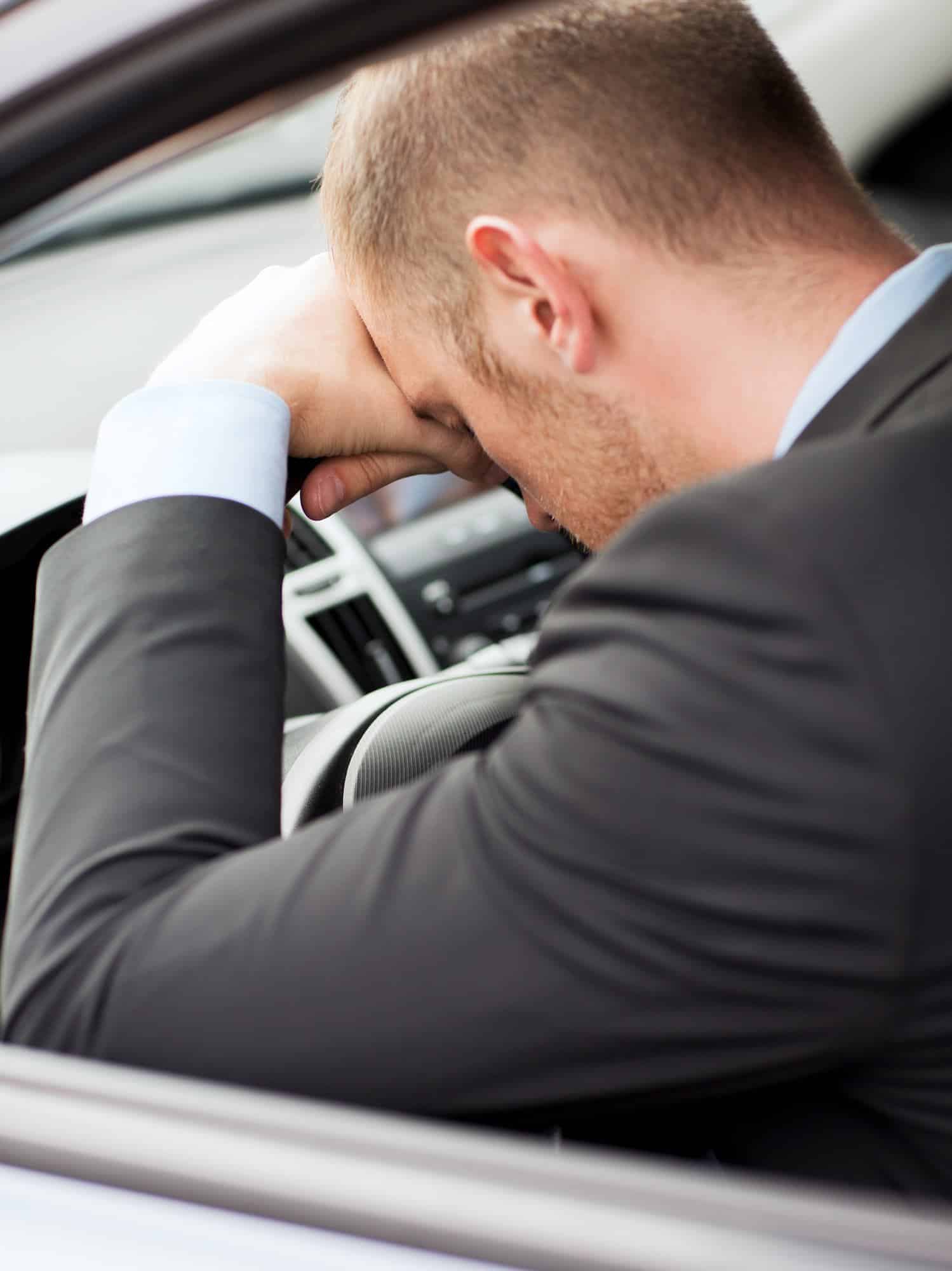tired businessman or taxi car driver