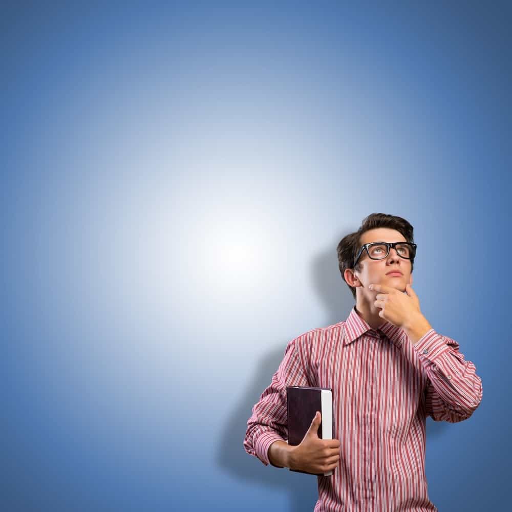 young man scientist with glasses thinking