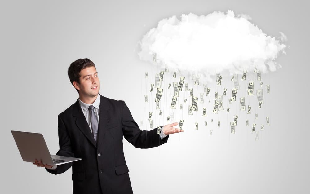 Man with cloud and money rain concept